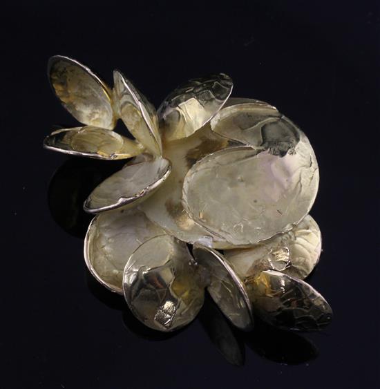 An early 1970s Chaumet 18ct gold stylised petal cluster clip brooch, 2.25in.